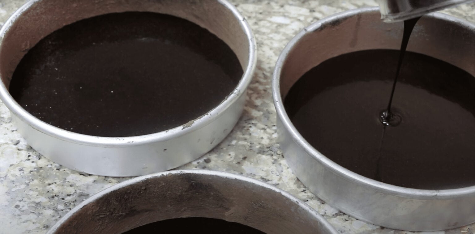 pouring cake batter in the pans